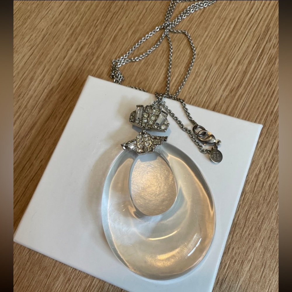 Alexis Bittar clear lucite pendant necklace w/crystals in silver tone setting.